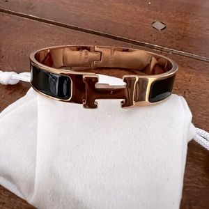 Hermes bangle black & rose gold.  no scratches but used 1time only.